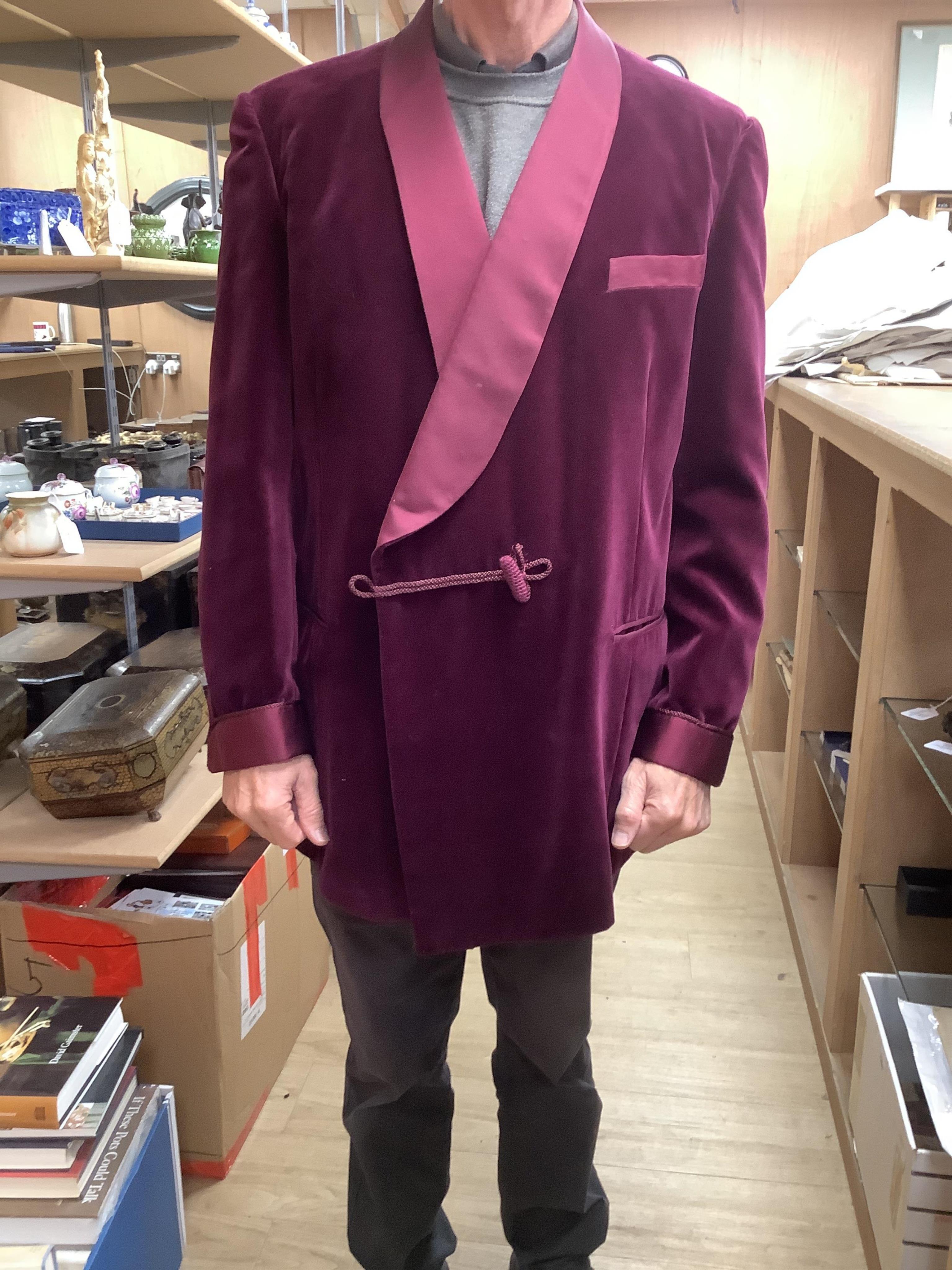 The property of a titled gentleman: A Redwood & Feller maroon velvet mid 20th century gentleman’s smoking jacket, with maroon silk cuff and collar detail, front chest 56cm.
